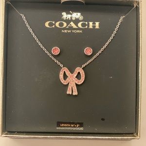 Coach new inbox pink Pave bow necklace earring set